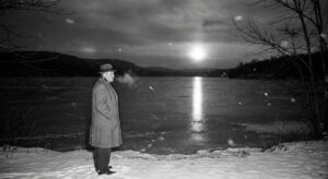 Mayor at frozen reservoir, beam on ice