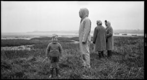Solway Firth family photo with suited figure