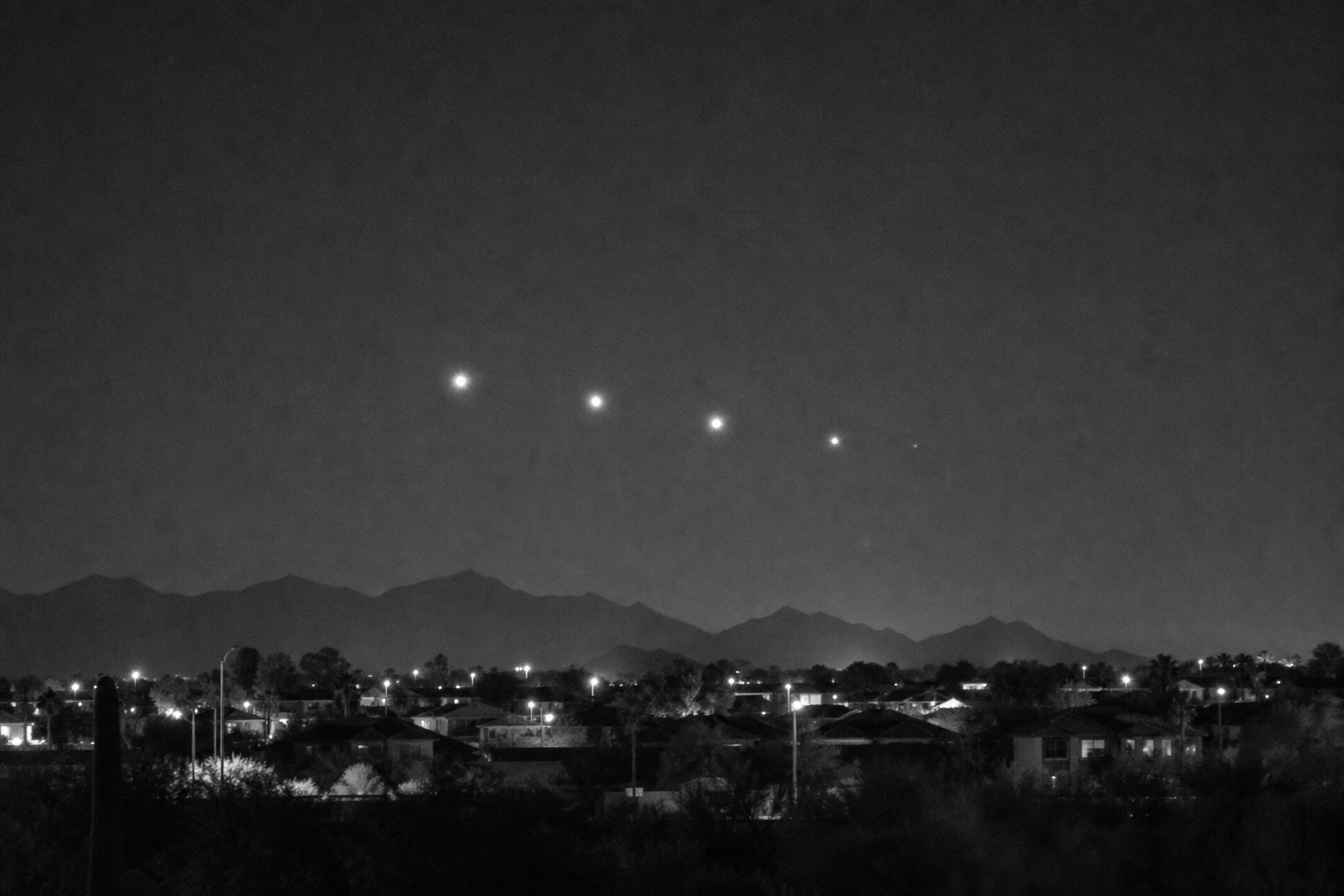 Stationary Lights Beyond the Mountains